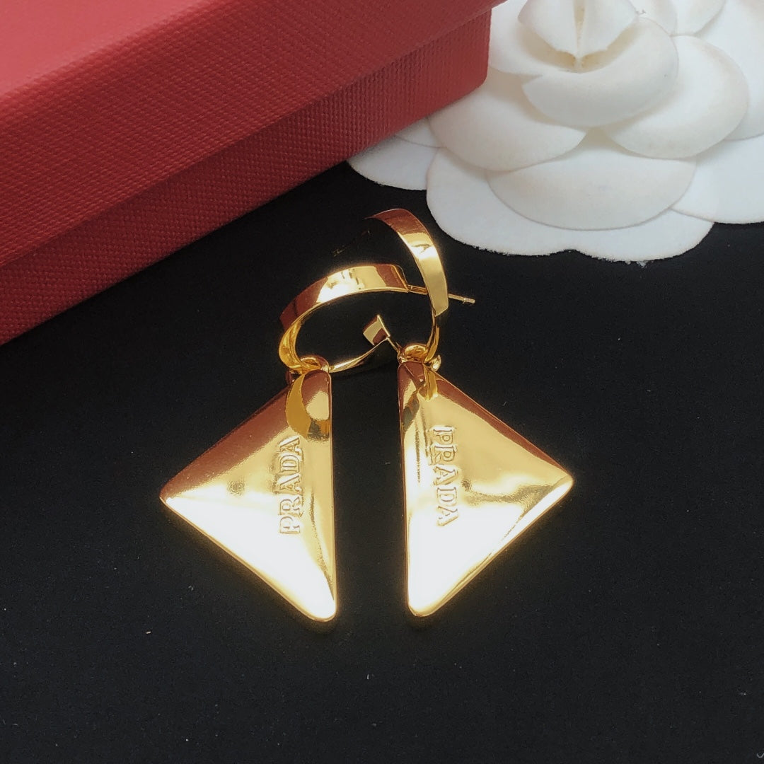 Martin Graham drop earrings in polished metal-tone – side detail