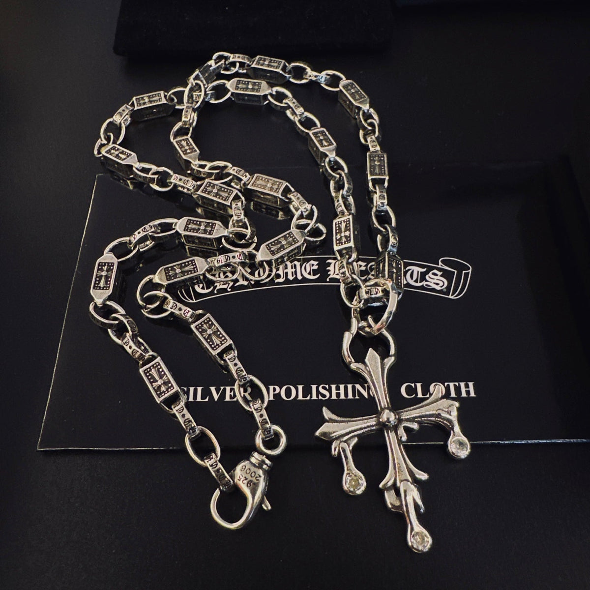 Martin Graham pendant necklace in polished metal-tone – side detail