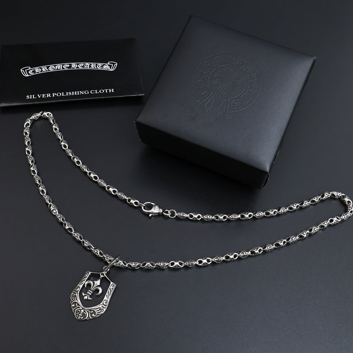 Martin Graham pendant necklace in polished metal-tone – side detail