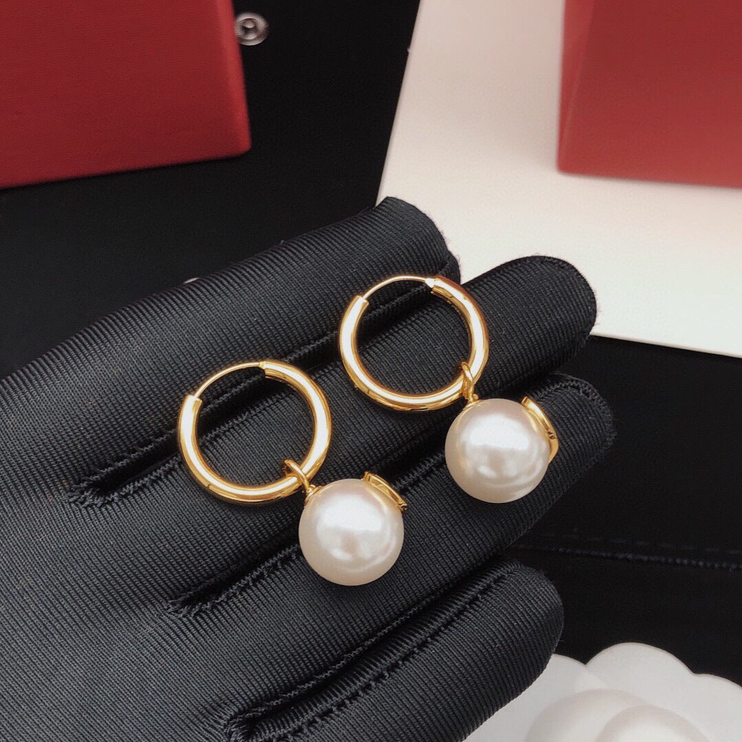 Martin Graham drop earrings in polished metal-tone – side detail