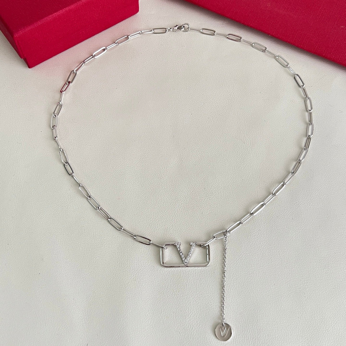 Martin Graham pendant necklace in polished metal-tone – side detail