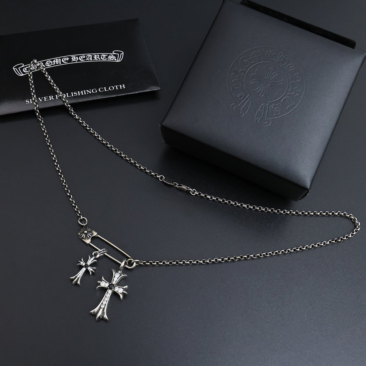 Martin Graham pendant necklace in polished metal-tone – side detail