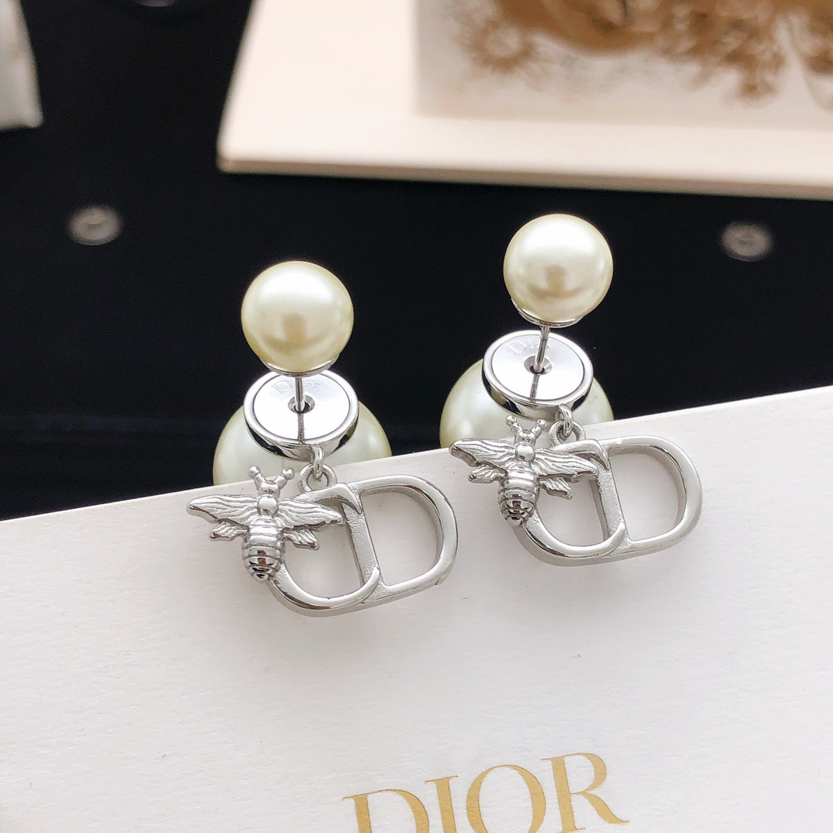 Martin Graham stud earrings in polished metal-tone – side detail