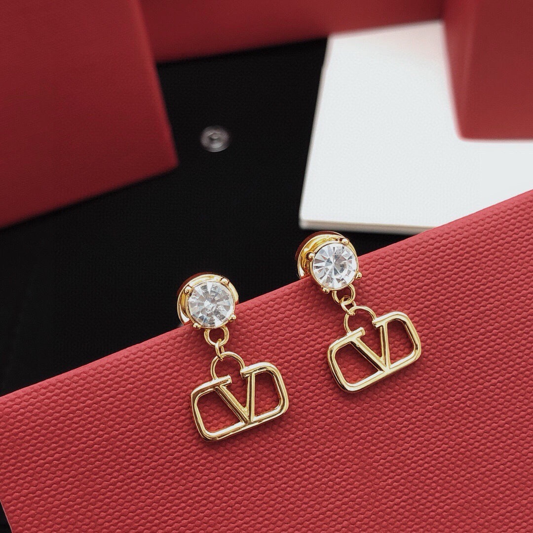Martin Graham stud earrings in polished metal-tone – side detail