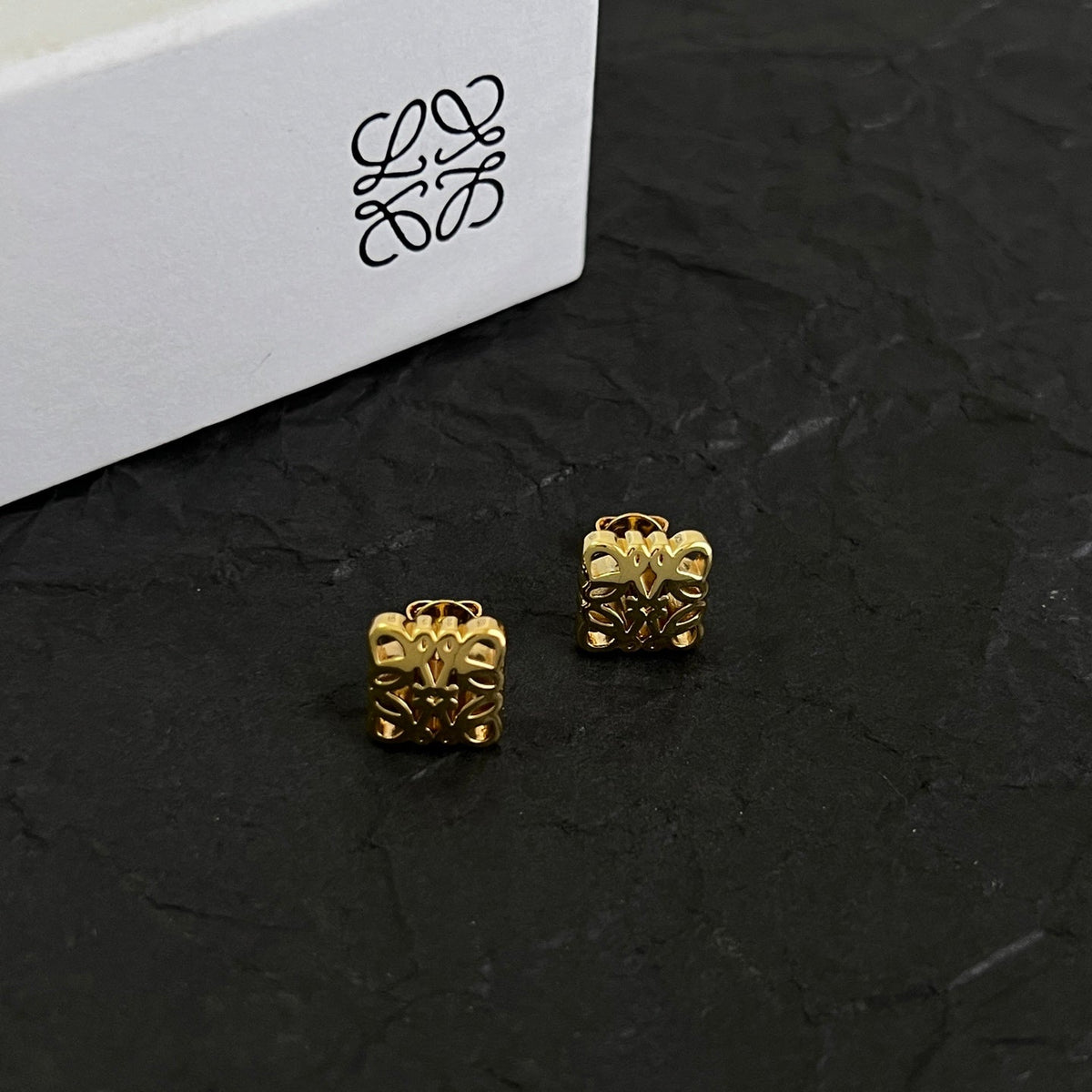 Martin Graham stud earrings in polished metal-tone – side detail