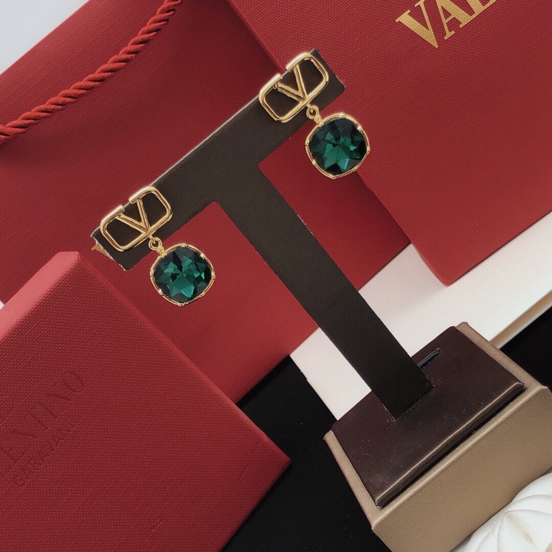 Martin Graham stud earrings in polished metal-tone – side detail