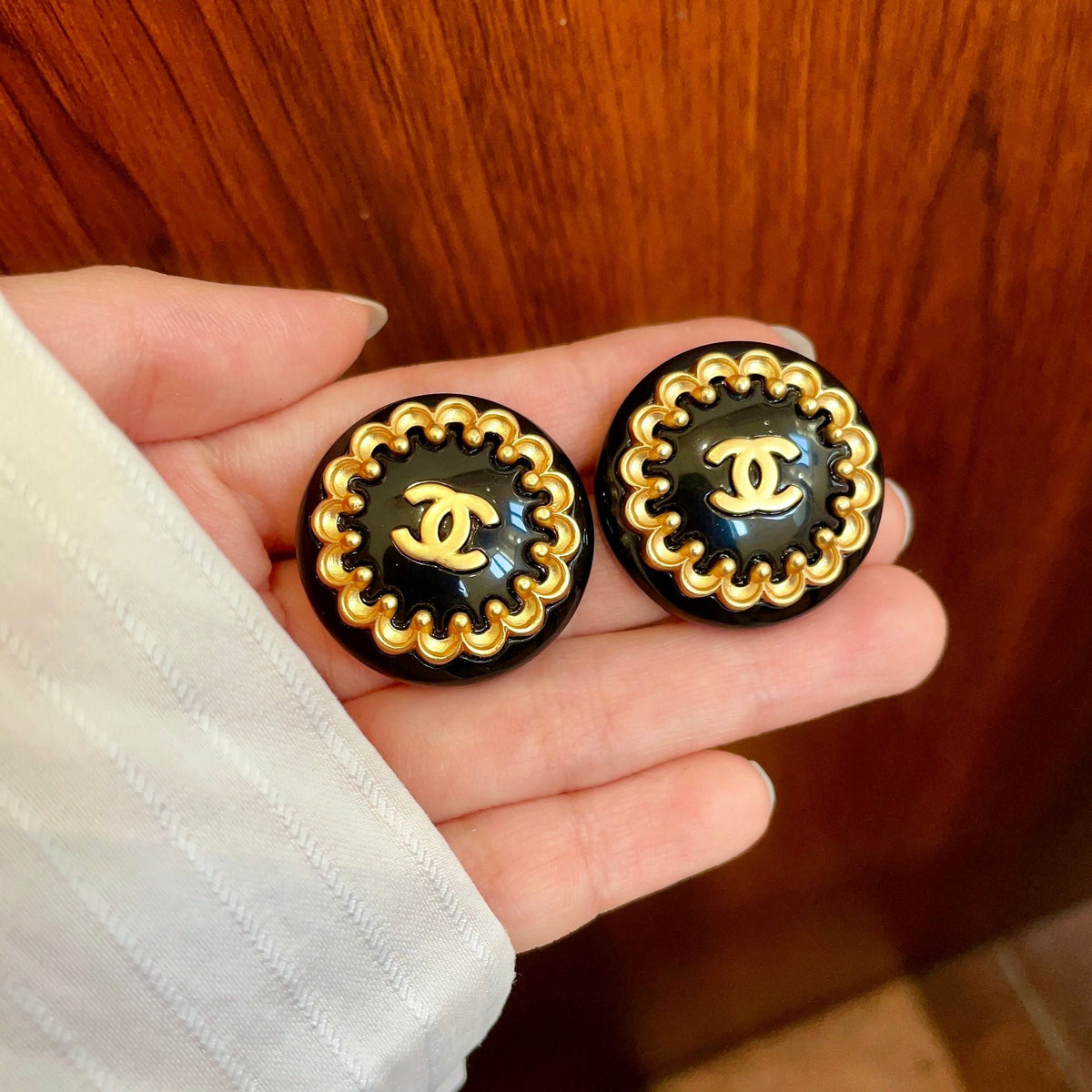 Martin Graham stud earrings in polished metal-tone – side detail