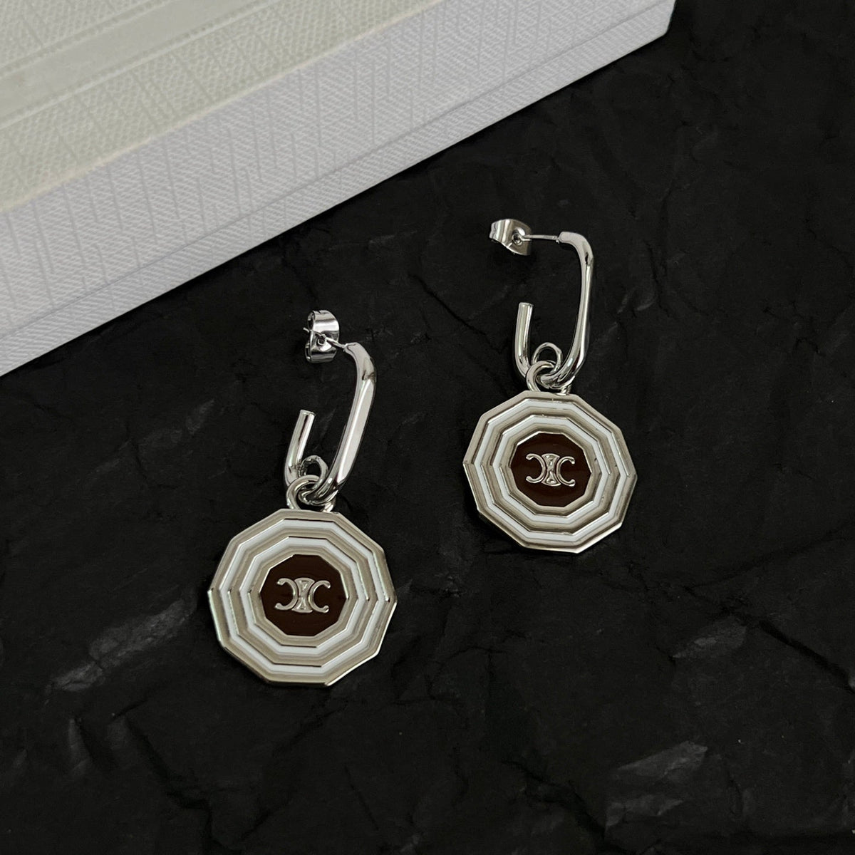 Martin Graham stud earrings in polished metal-tone – side detail