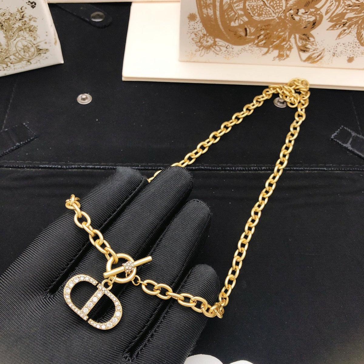 Martin Graham pendant necklace in polished metal-tone – side detail