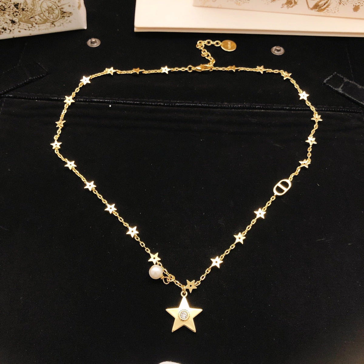 Martin Graham pendant necklace in polished metal-tone – side detail