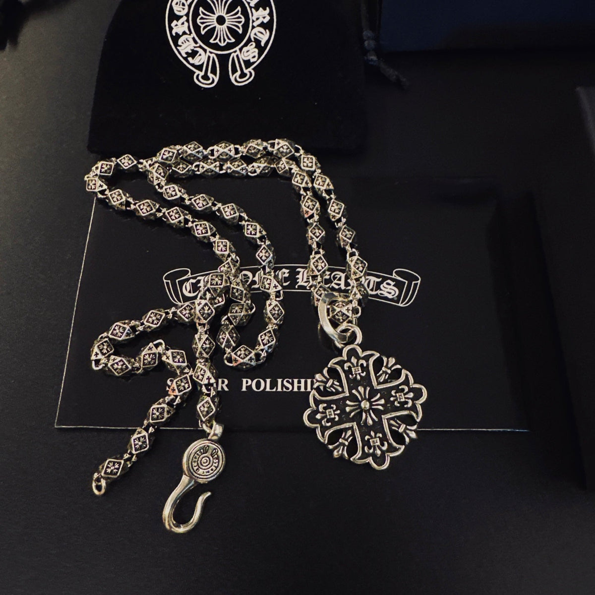 Martin Graham pendant necklace in polished metal-tone – side detail