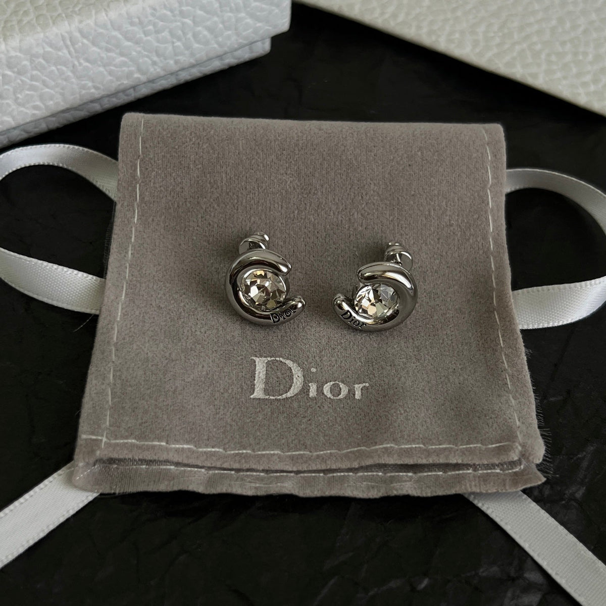 Martin Graham stud earrings in polished metal-tone – side detail