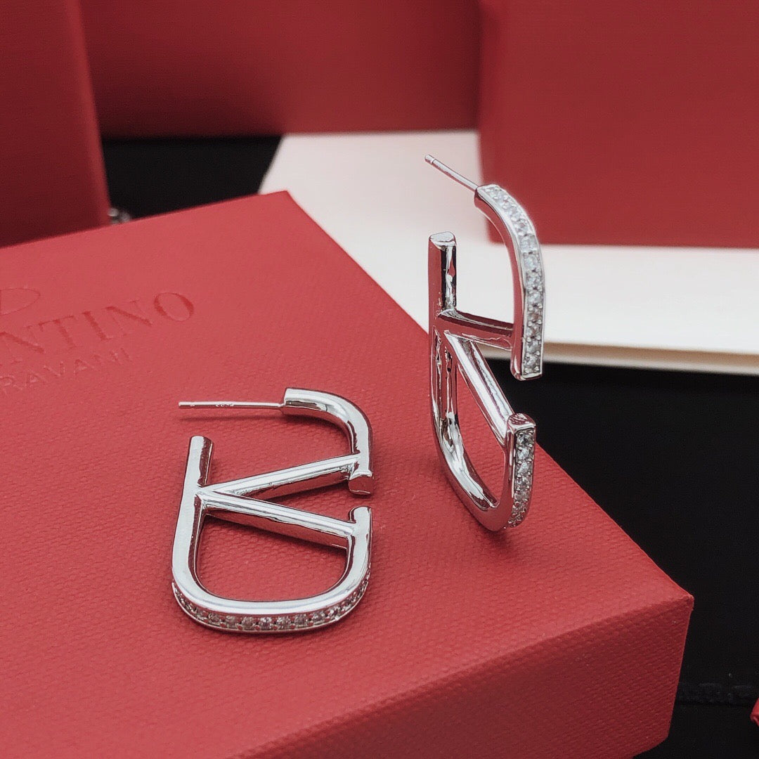 Martin Graham stud earrings in polished metal-tone – side detail