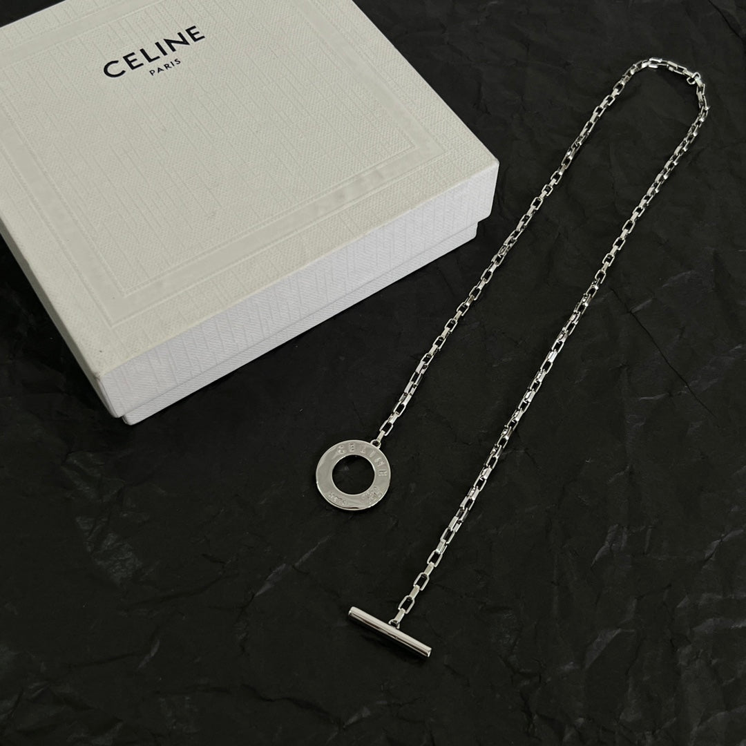 Martin Graham pendant necklace in polished metal-tone – side detail