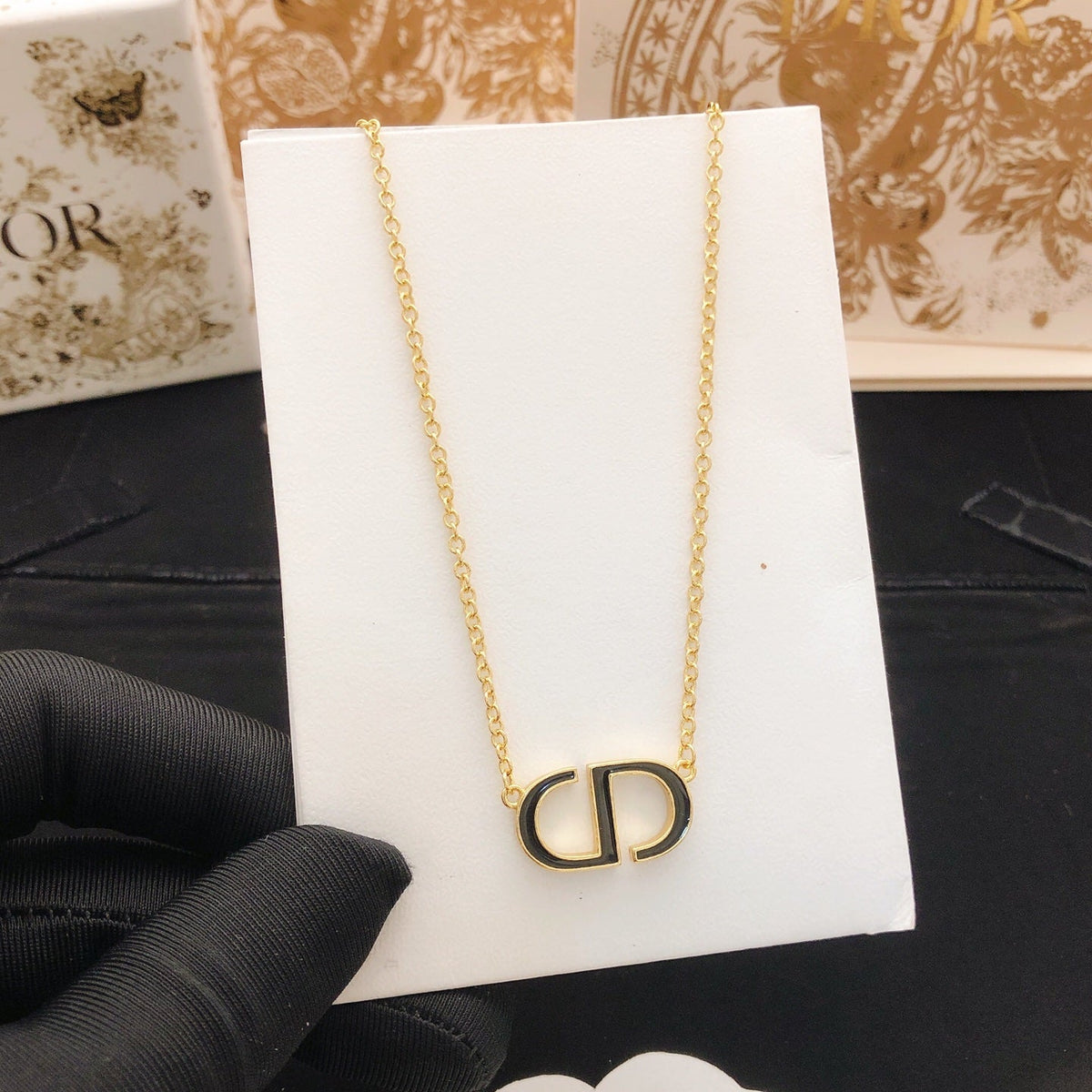 Martin Graham pendant necklace in polished metal-tone – side detail
