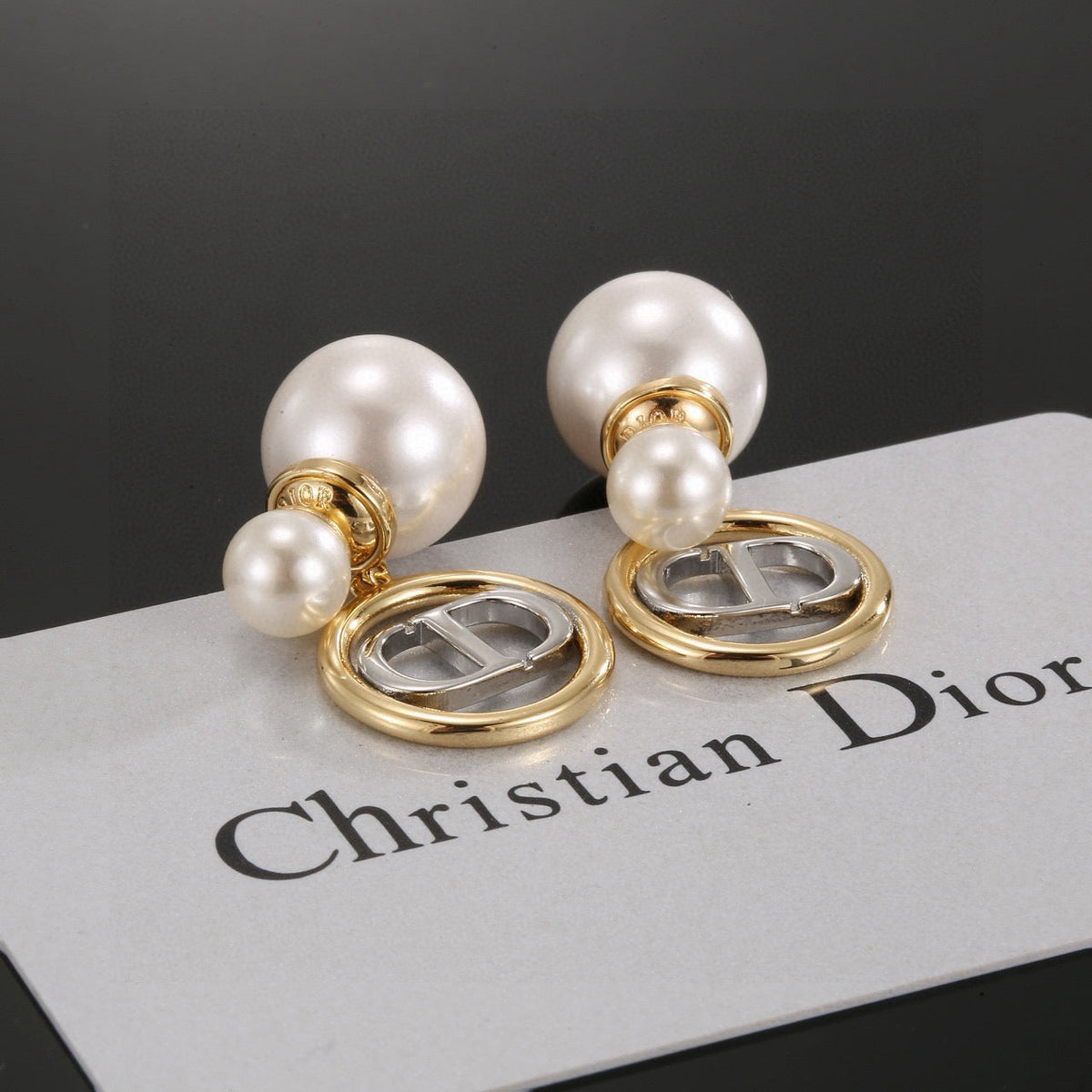 Martin Graham stud earrings in polished metal-tone – side detail