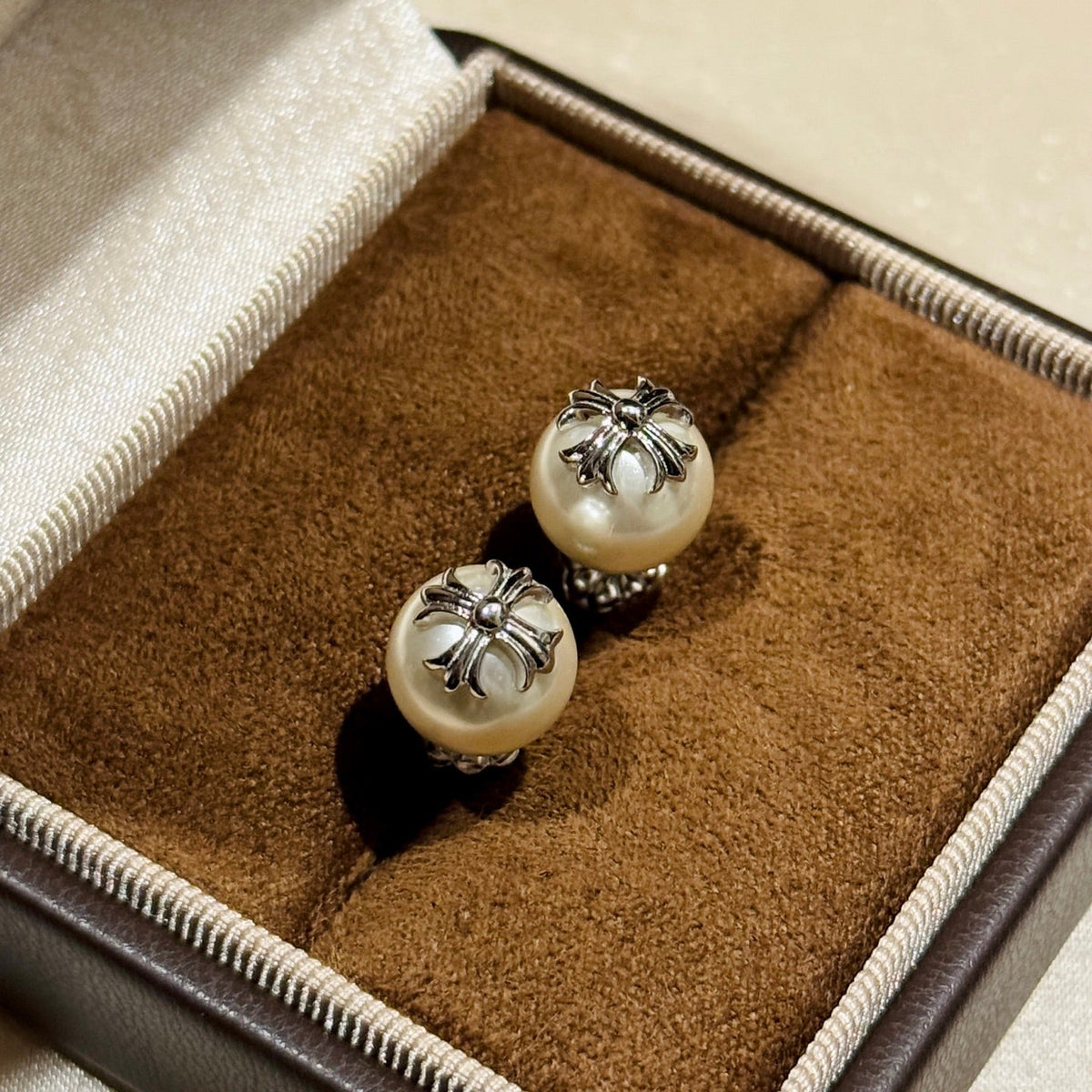 Martin Graham stud earrings in polished metal-tone – side detail