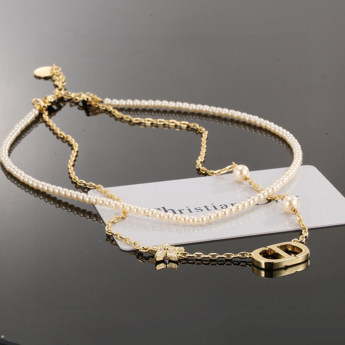 Martin Graham pendant necklace in polished metal-tone – side detail