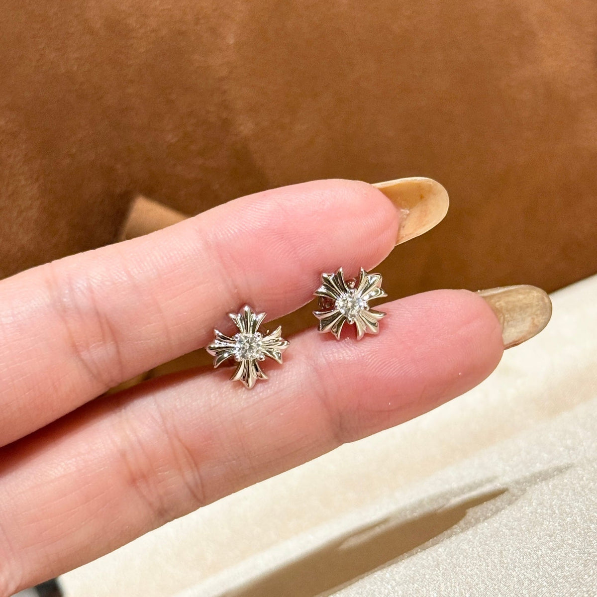 Martin Graham stud earrings in polished metal-tone – side detail