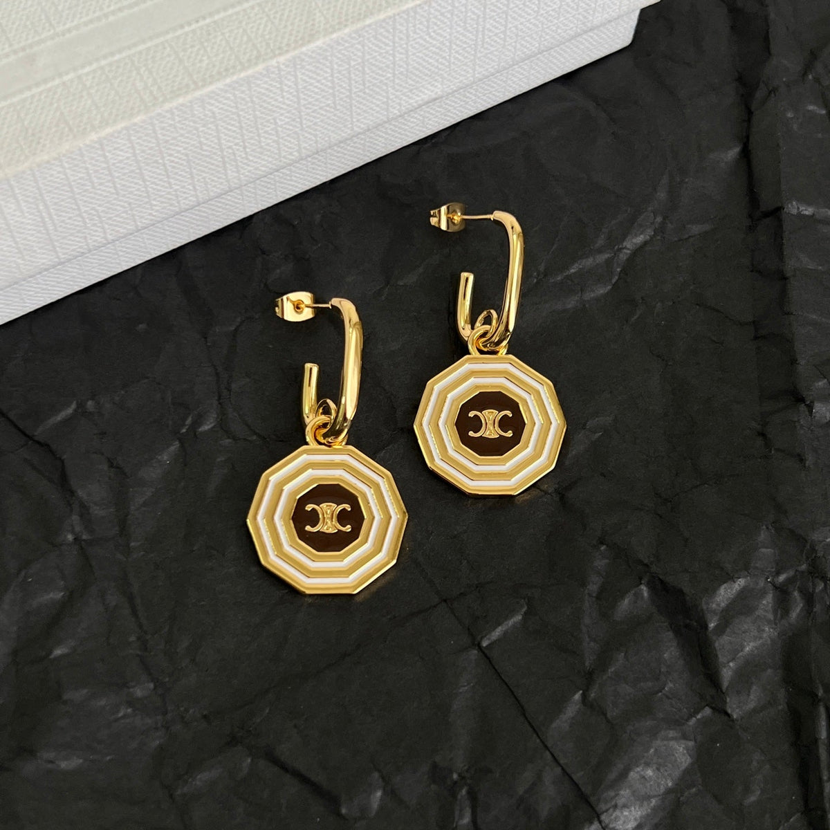 Martin Graham stud earrings in polished metal-tone – side detail