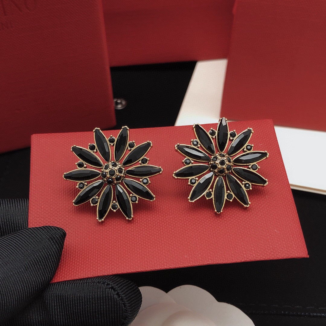 Martin Graham stud earrings in polished metal-tone – side detail
