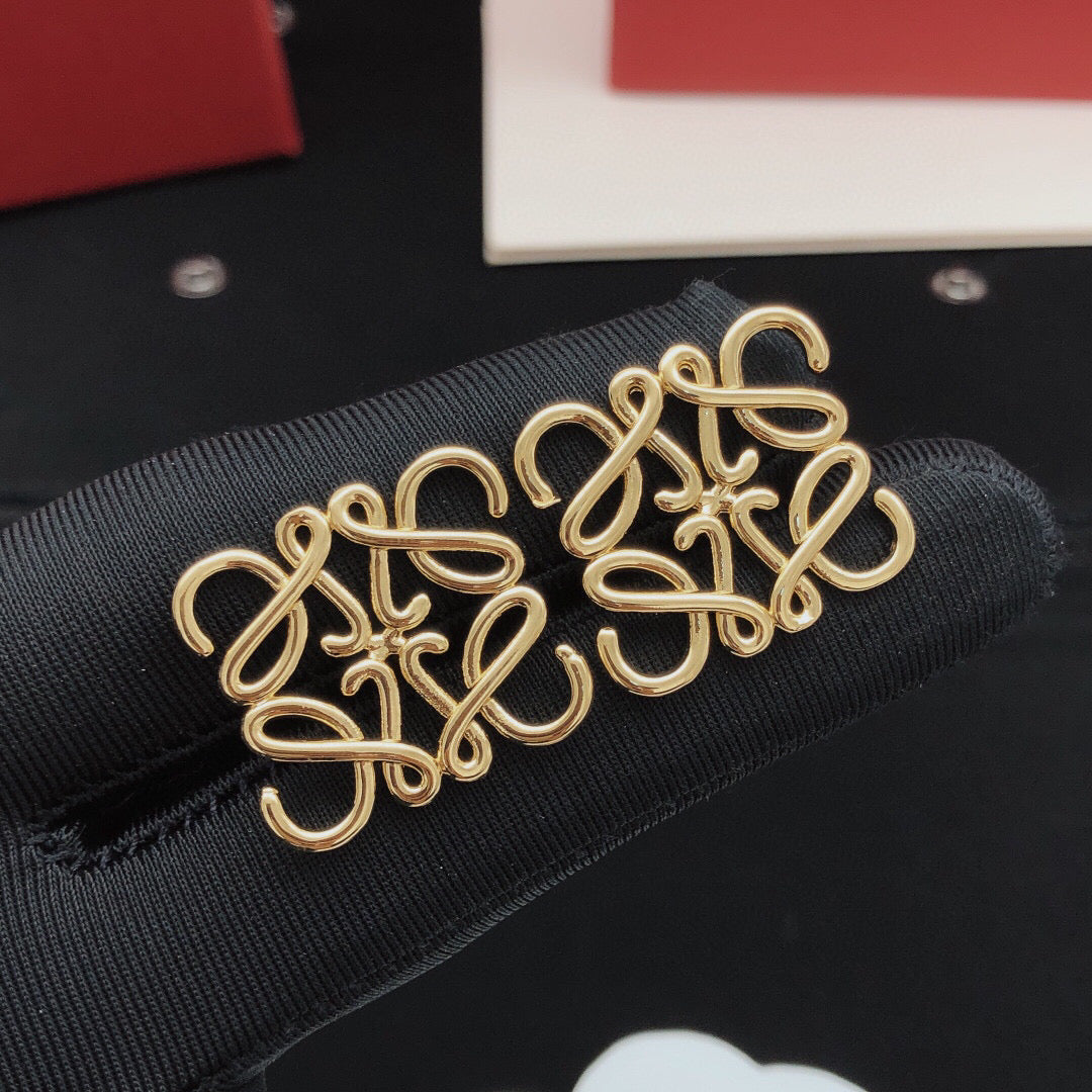 Martin Graham stud earrings in polished metal-tone – side detail