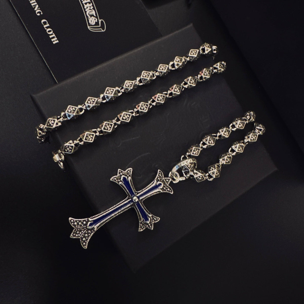 Martin Graham pendant necklace in polished metal-tone – side detail