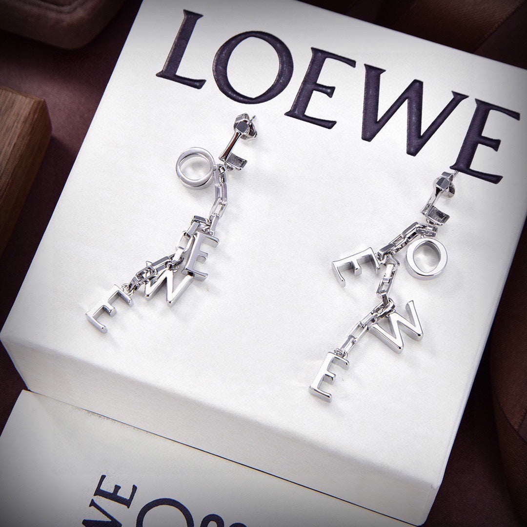 Martin Graham stud earrings in polished metal-tone – side detail