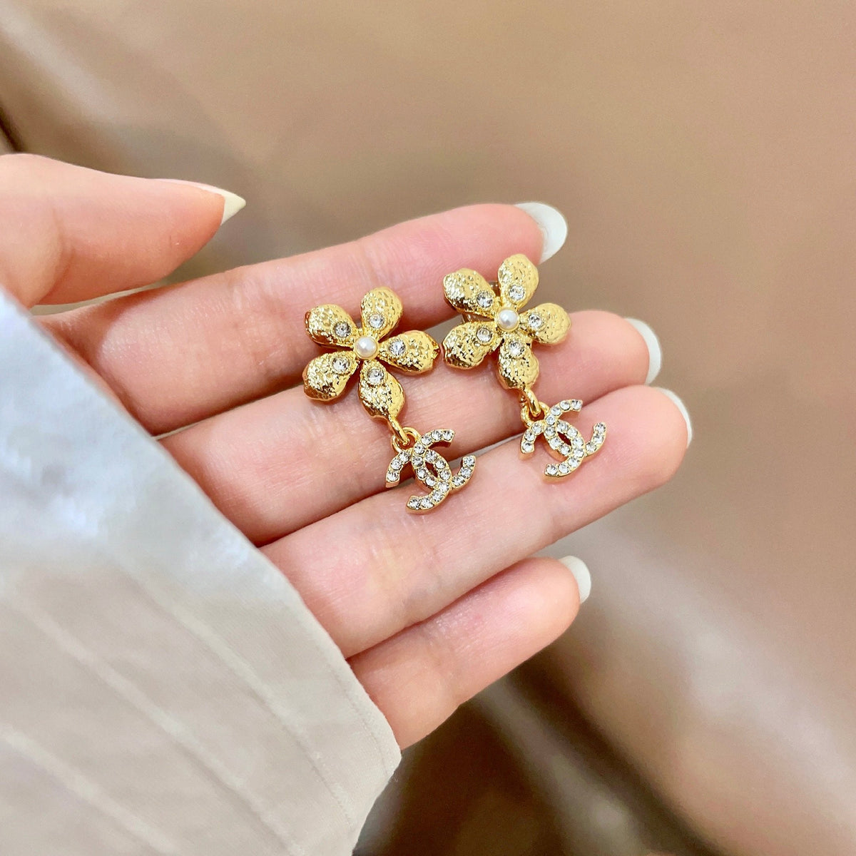 Martin Graham stud earrings in polished metal-tone – side detail