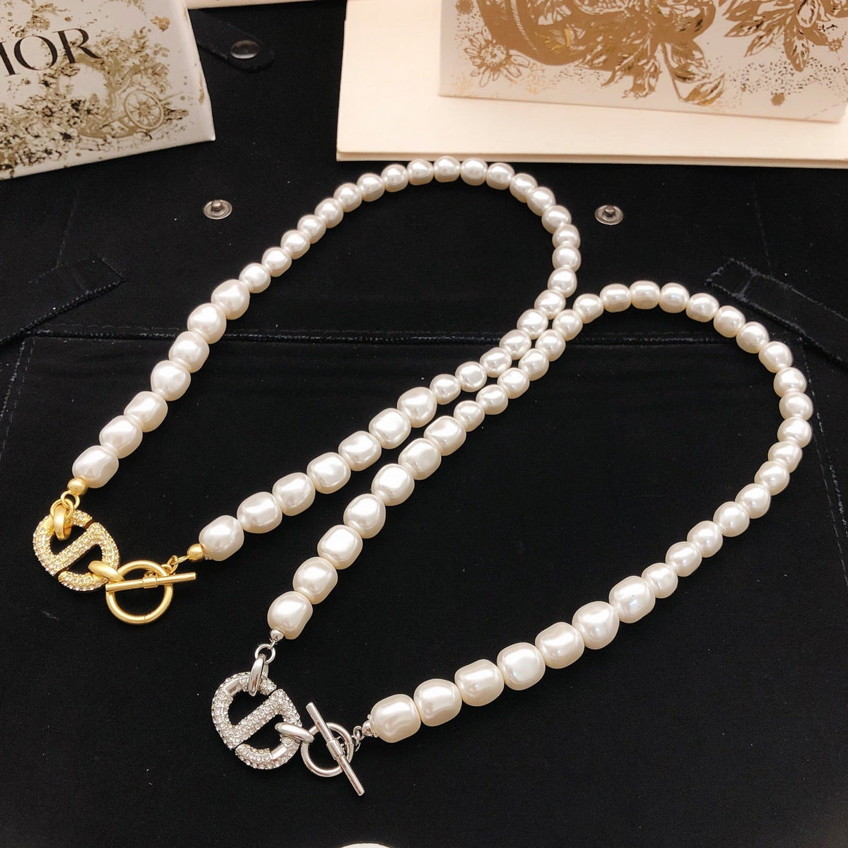 Martin Graham pendant necklace in polished metal-tone – side detail