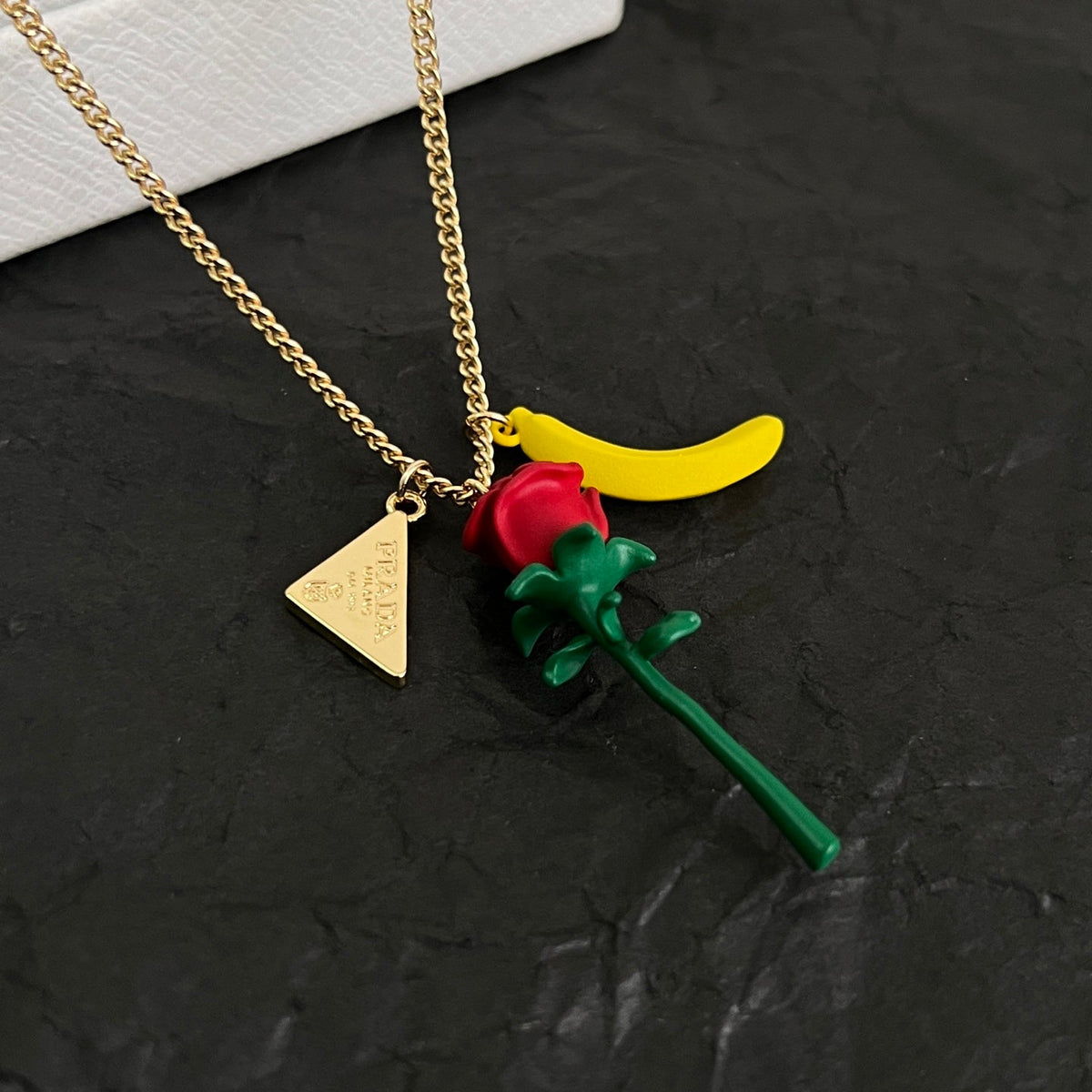 Martin Graham pendant necklace in polished metal-tone – side detail