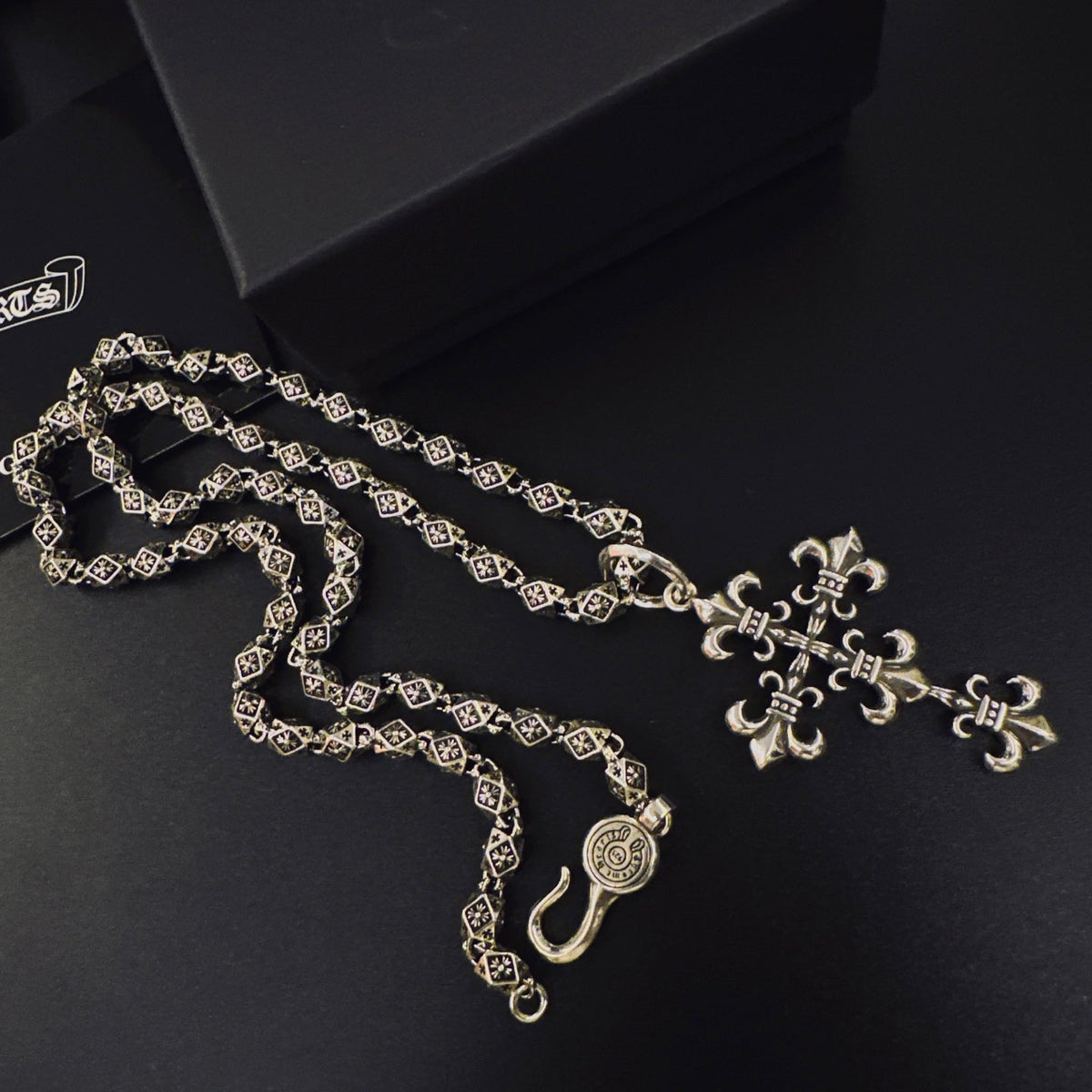 Martin Graham pendant necklace in polished metal-tone – side detail
