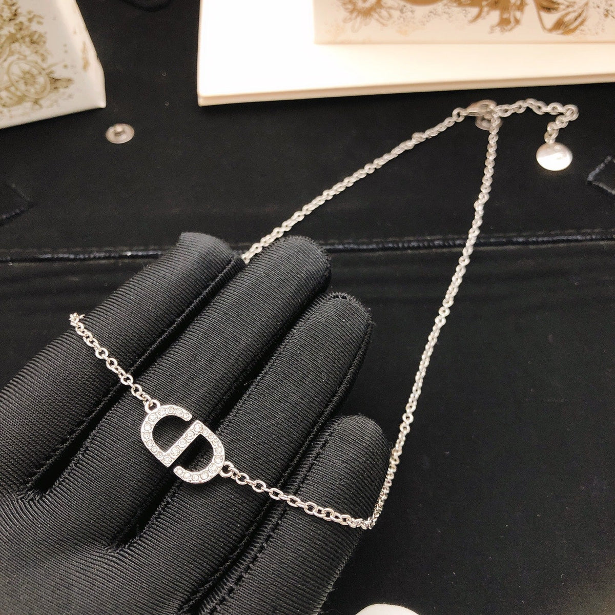 Martin Graham pendant necklace in polished metal-tone – side detail