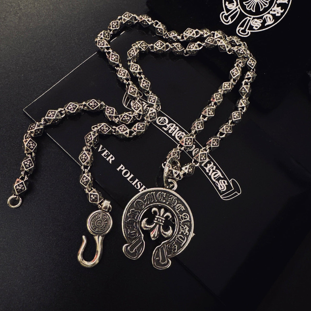 Martin Graham pendant necklace in polished metal-tone – side detail