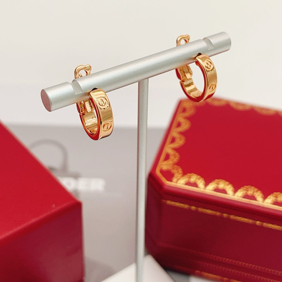 Martin Graham stud earrings in polished metal-tone – side detail
