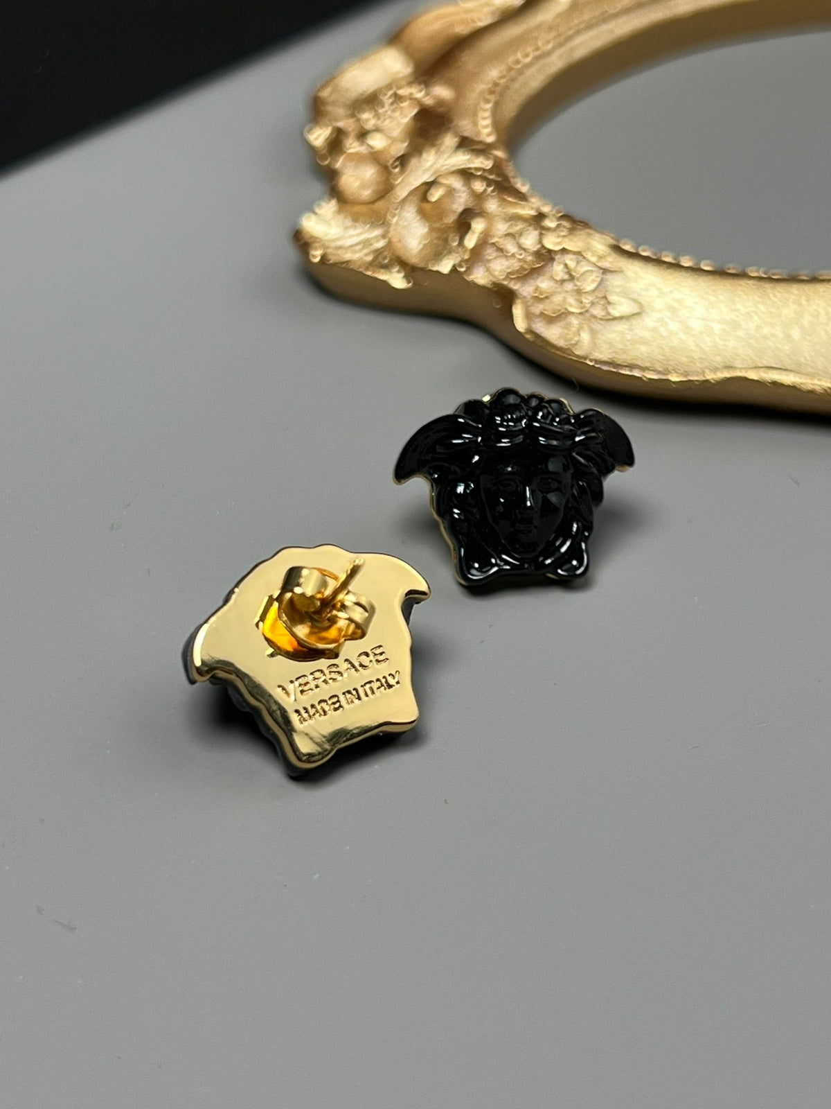 Martin Graham stud earrings in polished metal-tone – side detail