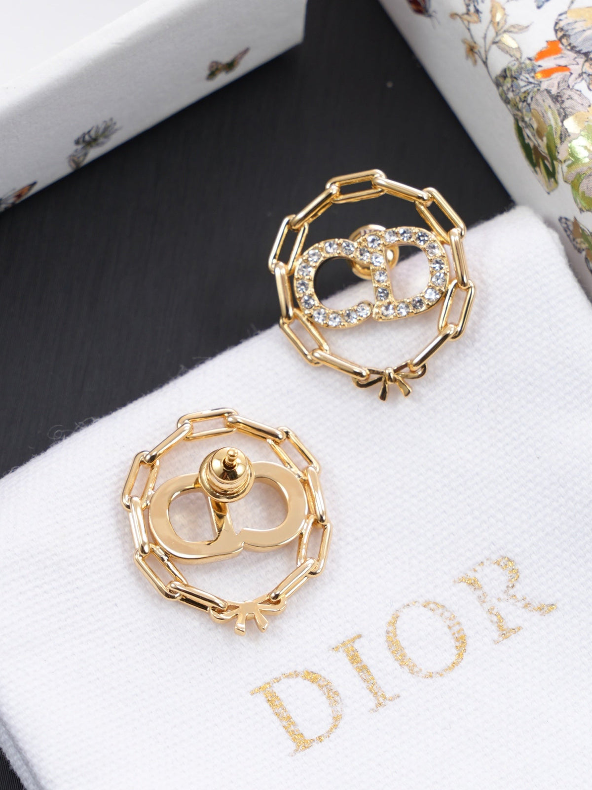 Martin Graham stud earrings in polished metal-tone – side detail
