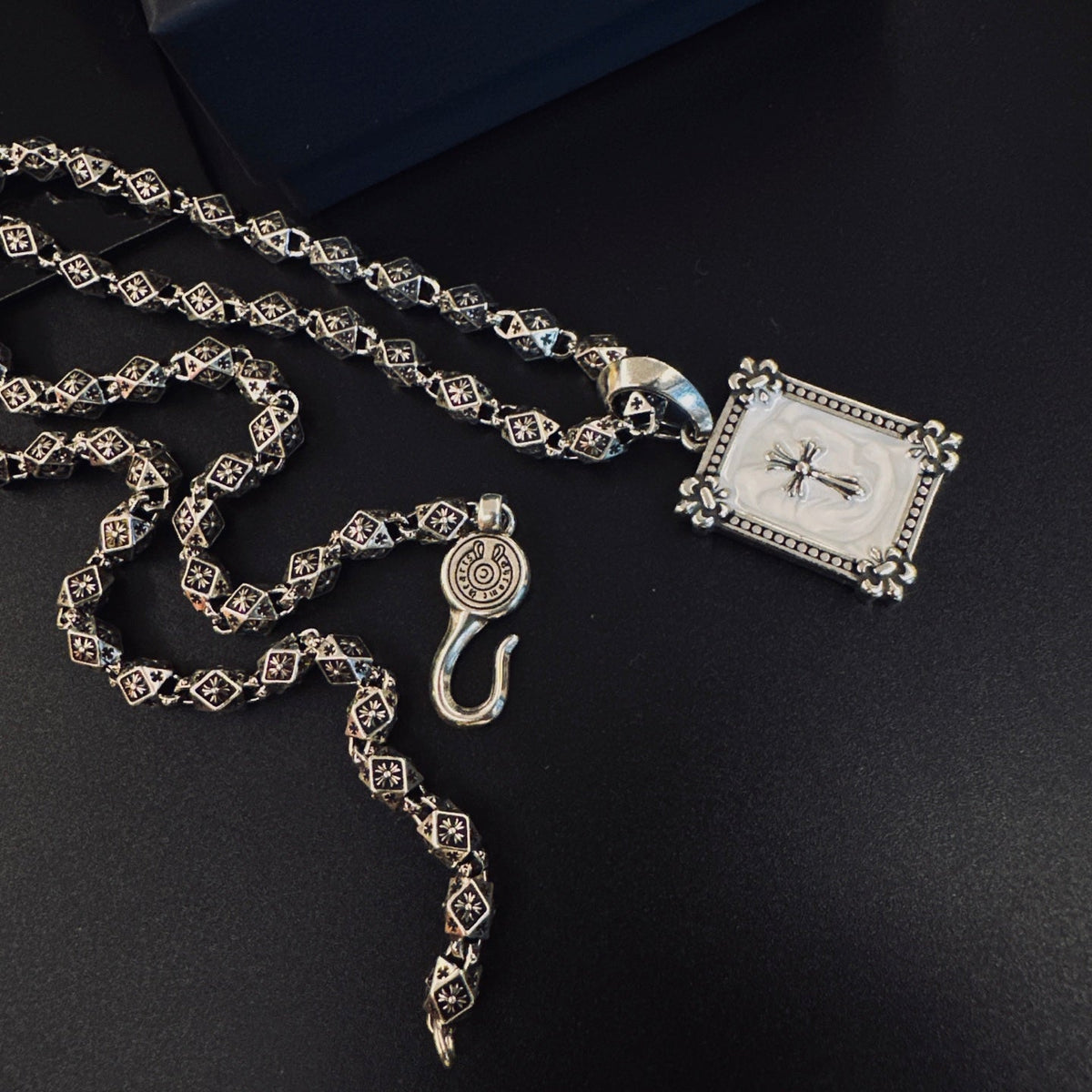 Martin Graham pendant necklace in polished metal-tone – side detail