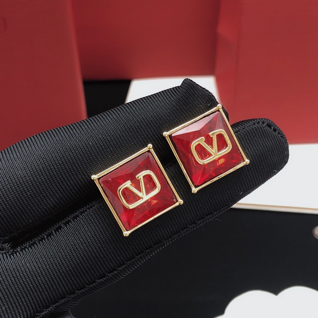 Martin Graham stud earrings in polished metal-tone – side detail