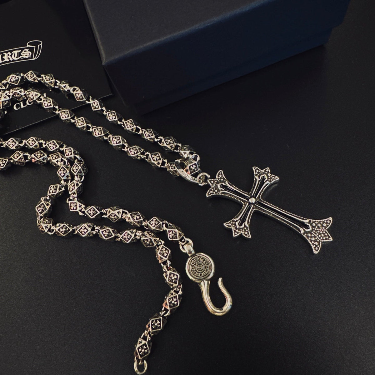 Martin Graham pendant necklace in polished metal-tone – side detail