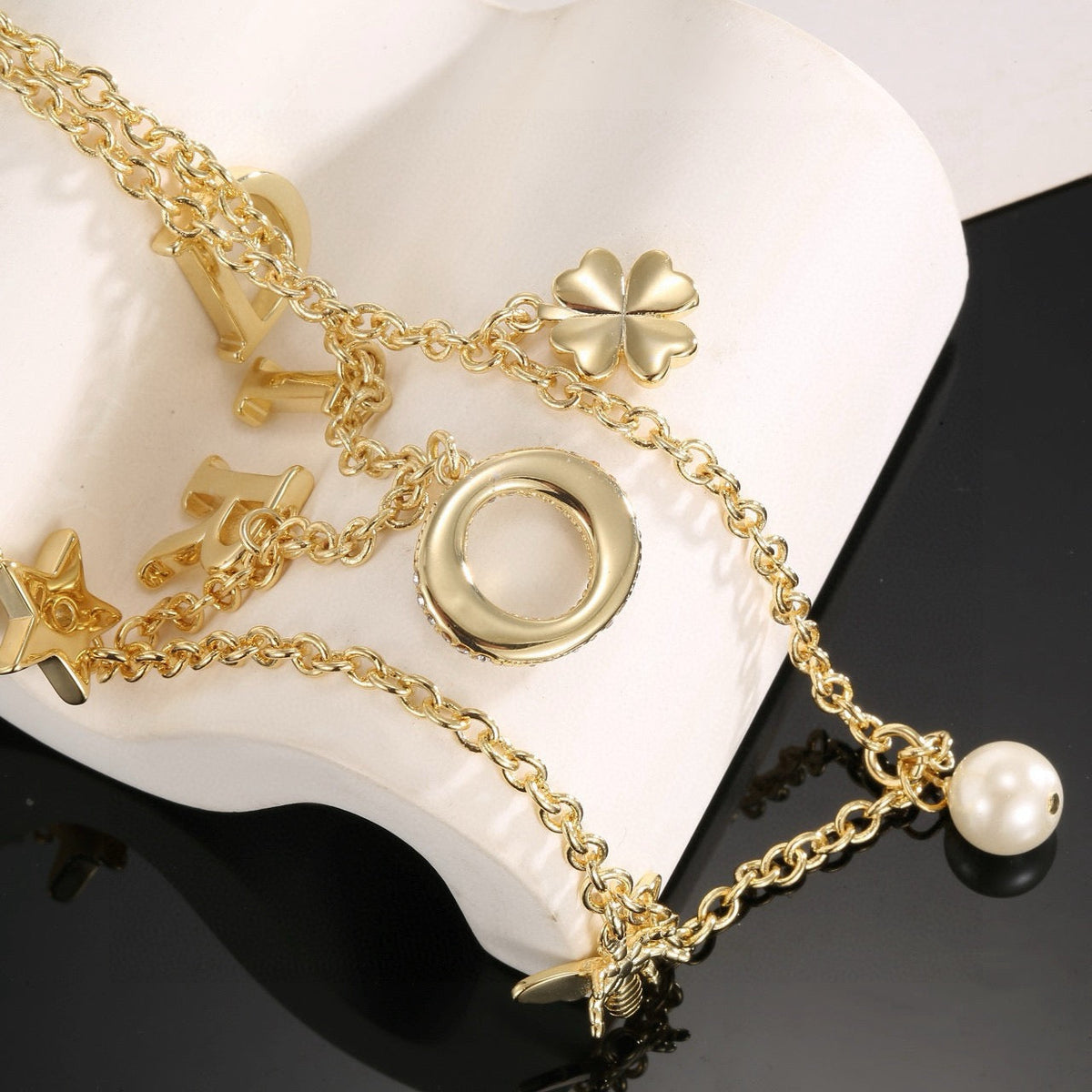 Martin Graham pendant necklace in polished metal-tone – side detail