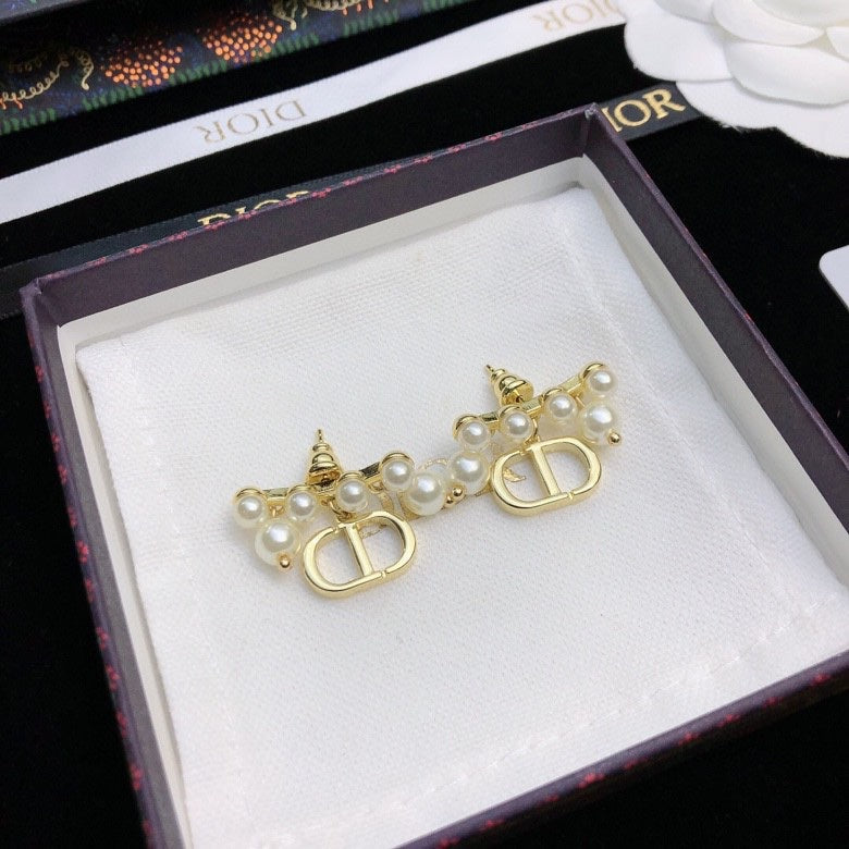 Martin Graham stud earrings in polished metal-tone – side detail