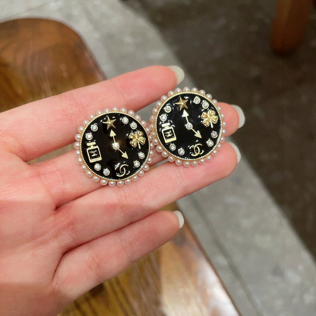 Martin Graham stud earrings in polished metal-tone – side detail