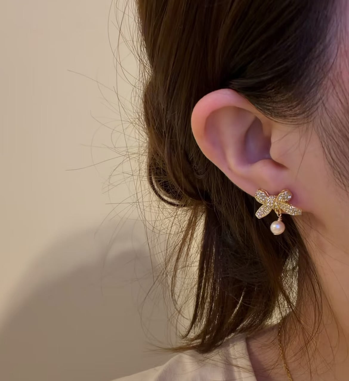 Martin Graham stud earrings in polished metal-tone – side detail