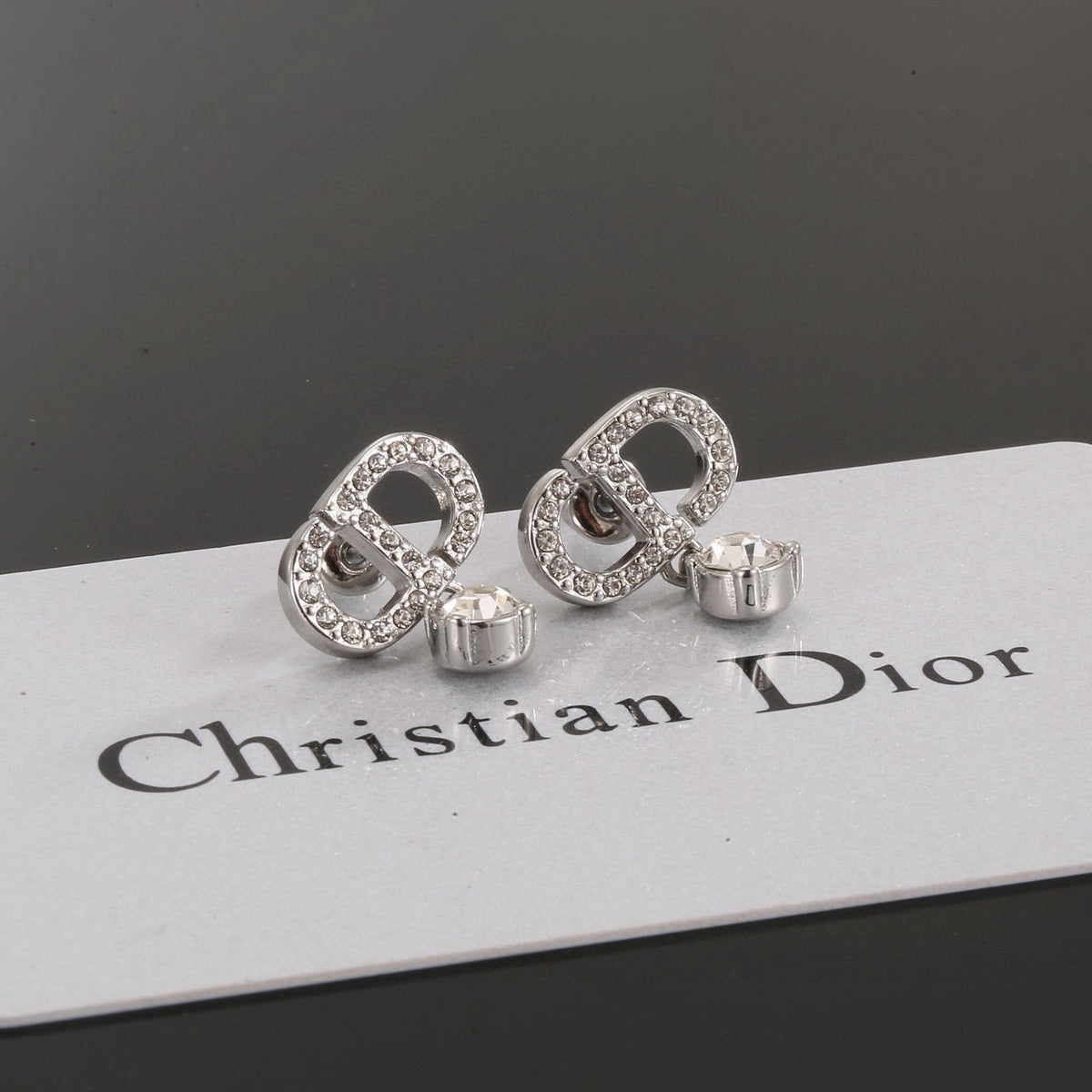 Martin Graham stud earrings in polished metal-tone – side detail