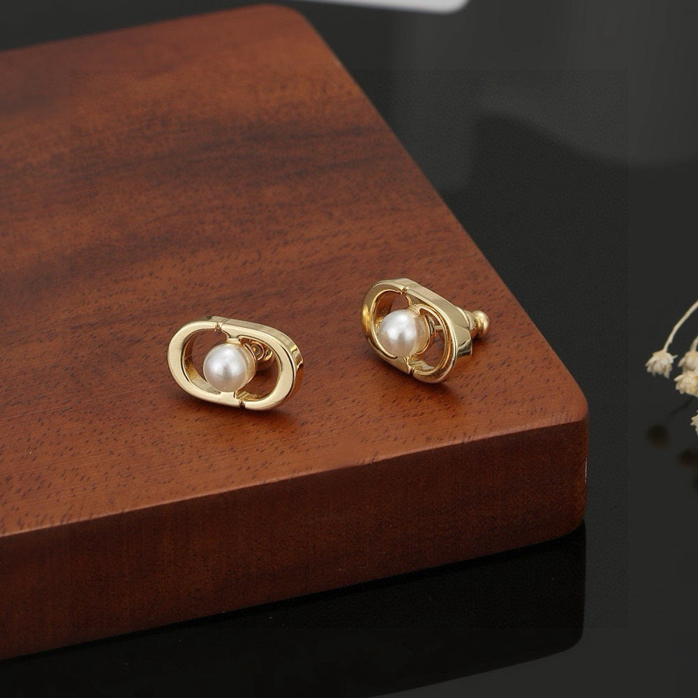 Martin Graham stud earrings in polished metal-tone – side detail