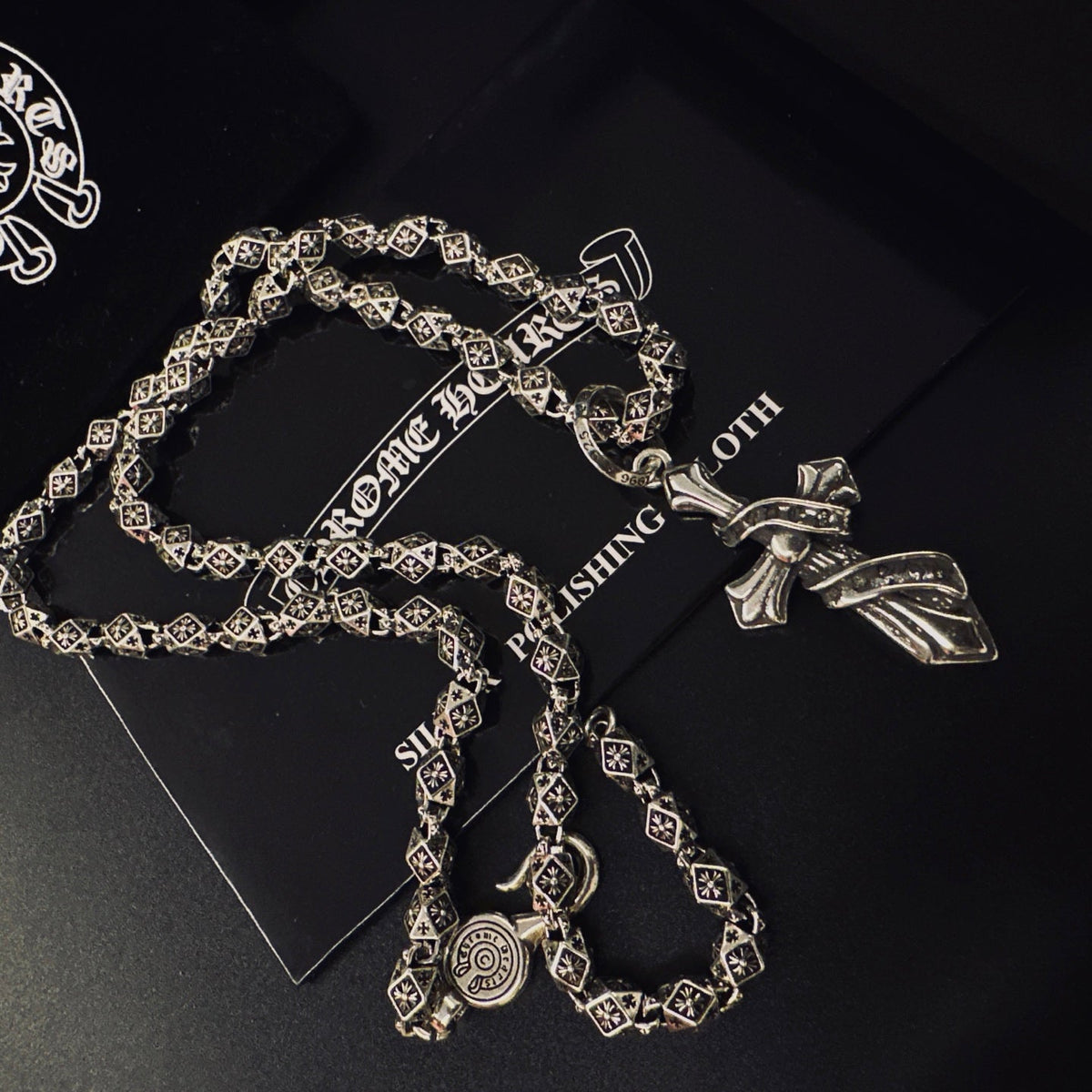 Martin Graham pendant necklace in polished metal-tone – side detail
