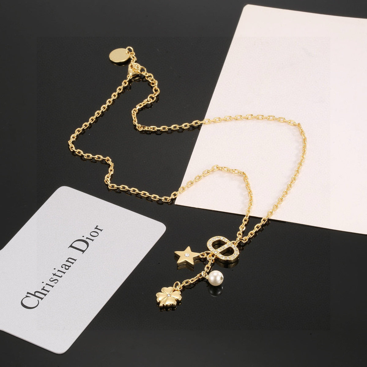 Martin Graham pendant necklace in polished metal-tone – side detail