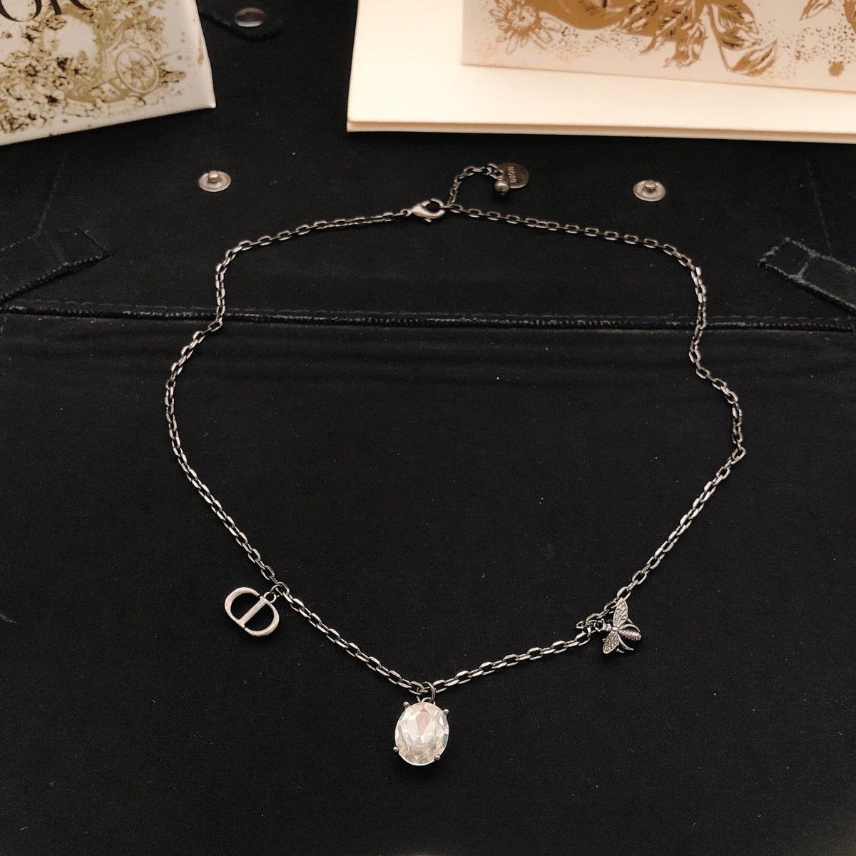 Martin Graham pendant necklace in polished metal-tone – side detail