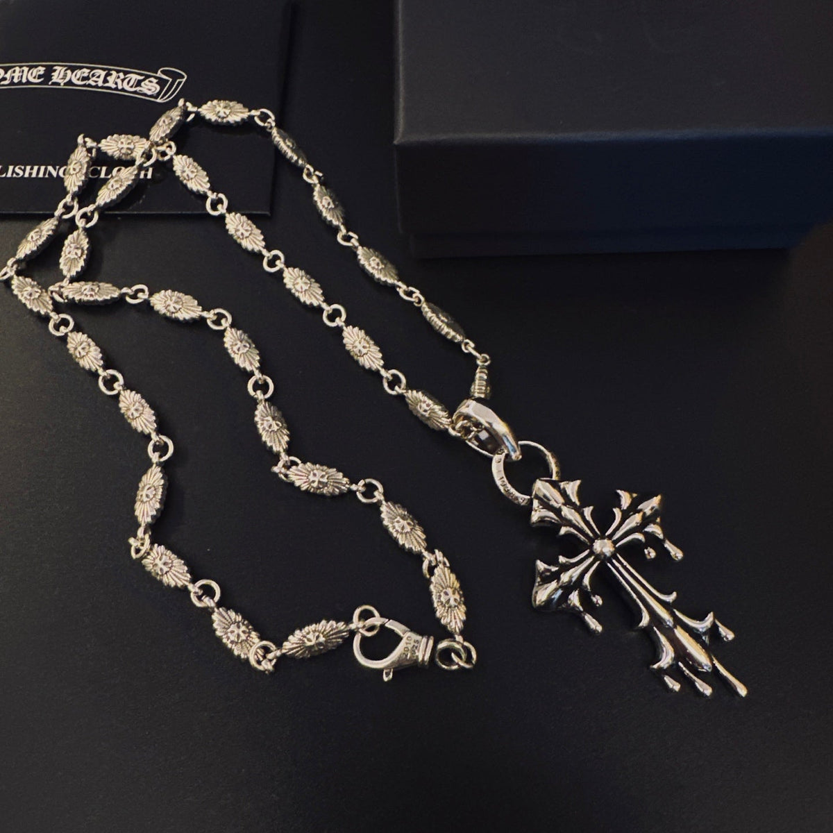 Martin Graham pendant necklace in polished metal-tone – side detail